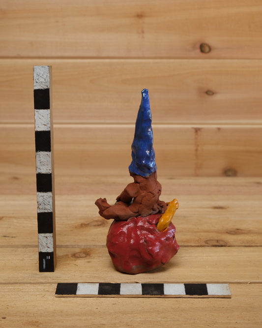 Gnome on Worm-Inhabited Apple
