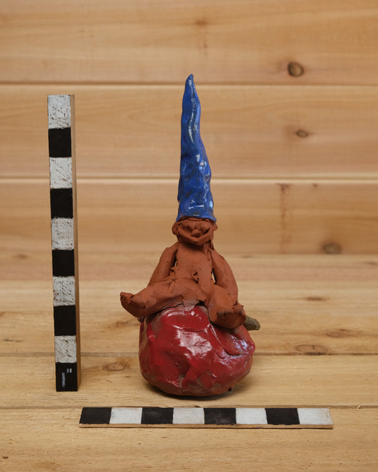 Gnome Sitting on Apple